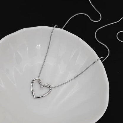RJ-183 Hollow Heart Pendant Necklace – Golden Stainless Steel Elegant Women Fashion Jewelry
